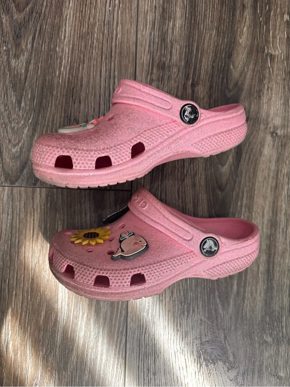 CROCS Kids Pink Glitter Slip-On Clogs with Sunflower & Character Charms